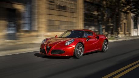 Sleek Red Sports Car in Motion wallpaper