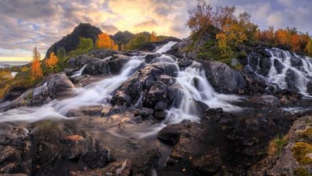 Serene Autumn Waterfall Scene wallpaper
