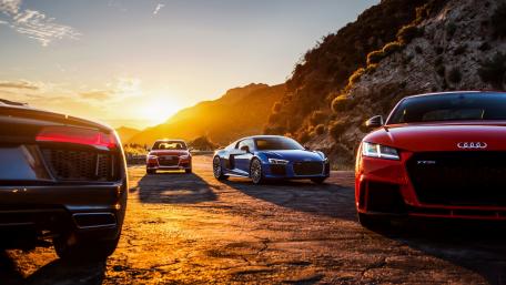 Sunset Drive with Luxury Cars at Horizon wallpaper