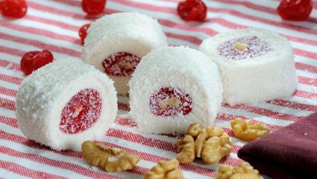 Delightful Coconut Rolls with Cherries and Nuts wallpaper