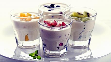 Delicious Fruit Yogurt Varieties in Elegant Glasses wallpaper