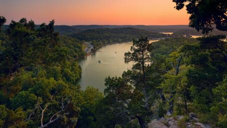Serene Sunset Over a Tranquil River Valley wallpaper