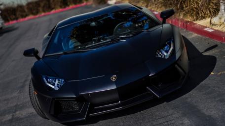 Sleek Black Lamborghini Aventador Wallpaper wallpaper