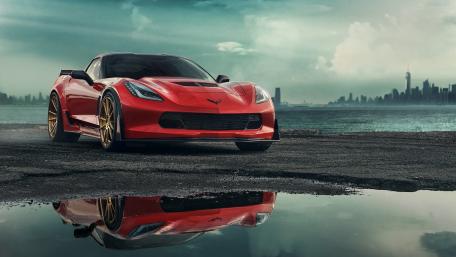 Sleek Red Corvette by the Waterfront wallpaper