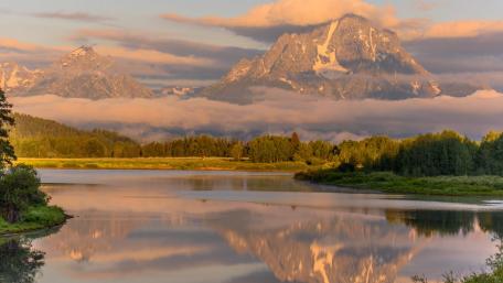 Majestic Mountains Reflected in Tranquil Waters wallpaper