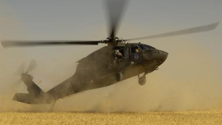 Military Helicopter in Action Over Wheat Field wallpaper