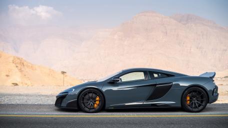 Sleek McLaren in Desert Setting wallpaper