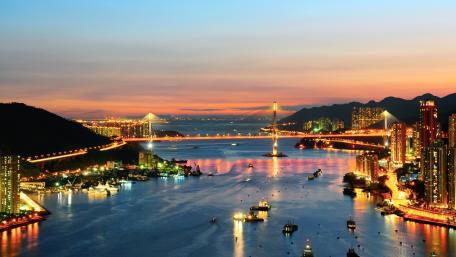 Vibrant Cityscape at Dusk with Illuminated Skyline wallpaper