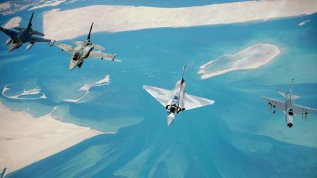 Aerial Formation of Military Jets Above the Oceanic Landscape wallpaper