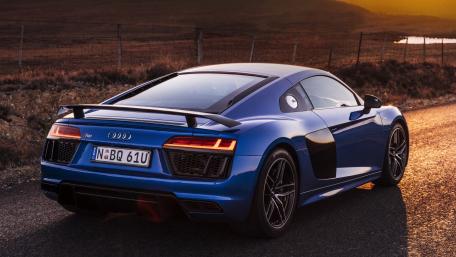 Sleek Audi R8 Against a Stunning Sunset Landscape wallpaper