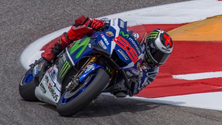 Racing Forward with Precision and Speed wallpaper