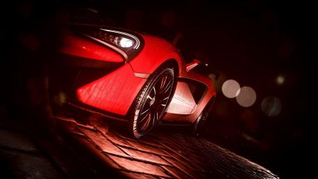 Sleek Red Sports Car in Rainy Night Scene wallpaper
