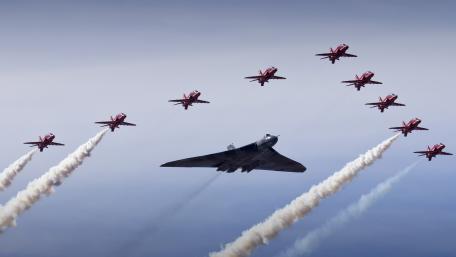 Aerial Combat Formation with Stealth Bomber and Fighter Jets wallpaper
