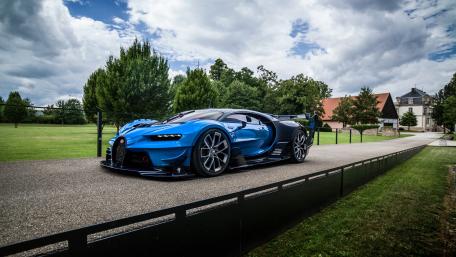 Sleek Blue Hypercar on a Scenic Driveway wallpaper