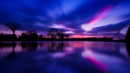Serene Dusk Reflection in Purple Hues wallpaper