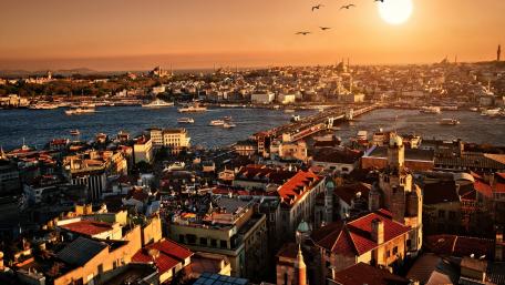 Golden Sunset Over a Vibrant Cityscape wallpaper