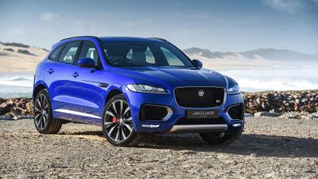 Sleek Blue Jaguar on the Shoreline wallpaper