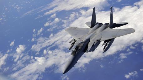 Fighter Jet Soaring Through the Clouds wallpaper