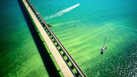 Tranquil Waters and Majestic Bridge Scene wallpaper