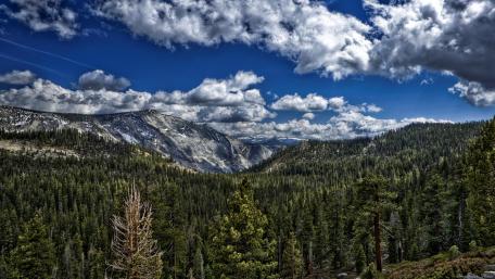 Majestic Mountain Landscape Under Dynamic Skies wallpaper