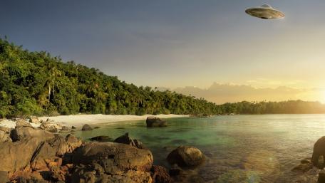 Mysterious UFO Over Serene Beach Scene wallpaper