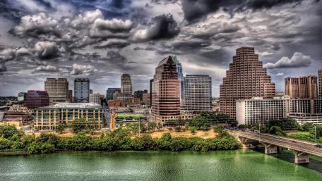 Urban Dreamscape Under Dramatic Skies wallpaper