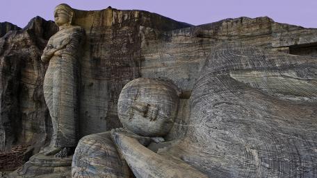 Ancient Serenity of Sculpted Stone Figures wallpaper