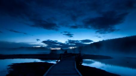 Mysterious Blue Twilight Over Calm Waters wallpaper
