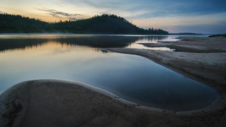Serene Riverbank at Dusk wallpaper