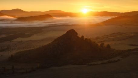 Golden Sunrise Over Serene Landscape wallpaper