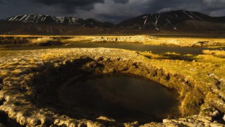 Majestic Landscape Under Dark Clouds wallpaper