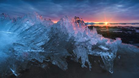 Icy Dawn Over Crystal Peaks wallpaper