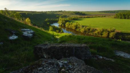 Serene River Valley Awakens in Nature's Embrace wallpaper
