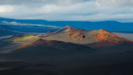Majestic Desert Landscape Under Cloudy Skies wallpaper