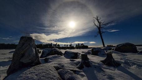 Silent Moonlit Landscape Beneath a Spectacular Halo wallpaper