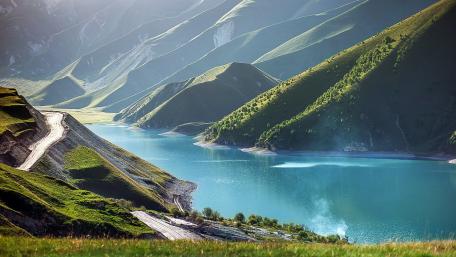 Serene Mountain Lake and Lush Green Hills wallpaper