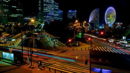 Vibrant Night Cityscape with Ferris Wheel wallpaper
