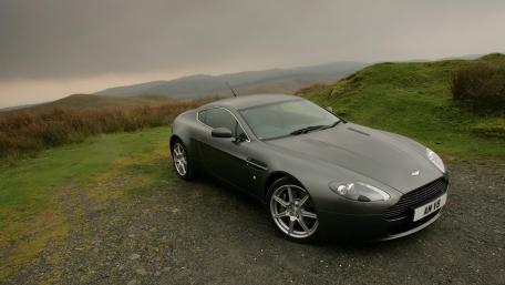 Sleek Aston Martin on a Serene Landscape wallpaper