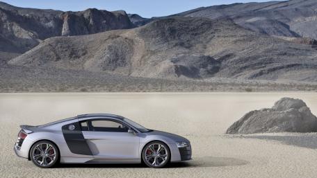 Sleek Silver Sports Car in Desert Landscape wallpaper