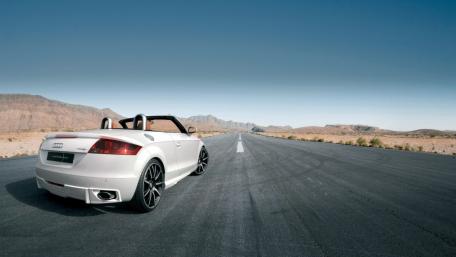 Sleek Convertible on an Empty Highway wallpaper