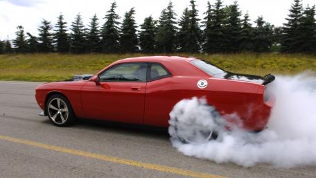 Red Muscle Car in Action wallpaper