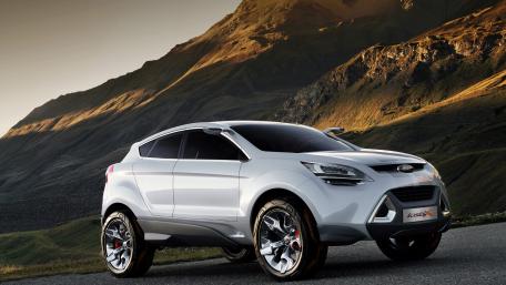 Sleek Modern SUV Against Mountain Landscape wallpaper