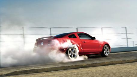 Dynamic Red Mustang Igniting the Track wallpaper