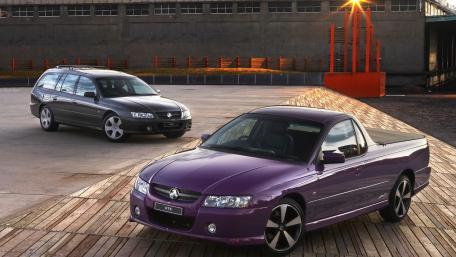 Stylish Performance Cars in Urban Setting wallpaper