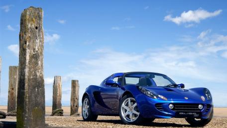 Sleek Blue Sports Car by the Shoreline wallpaper
