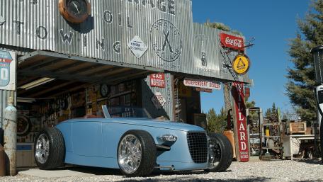 Vintage Car in Rustic Garage Setting wallpaper