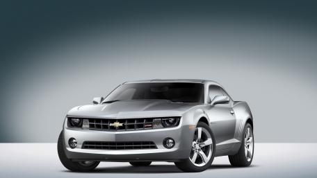 Sleek Silver Camaro in Modern Setting wallpaper