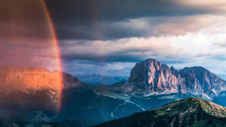 Majestic Mountain Landscape with Rainbow and Clouds wallpaper