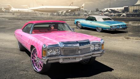 Vibrant Classic Cars at the Airport Scene wallpaper