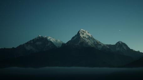 Majestic Peaks Under a Starlit Sky wallpaper